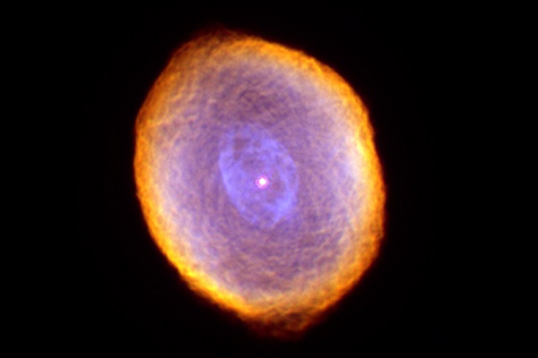In this picture of the Spirograph Nebula, a dying star about 2,000 light-years from Earth, NASA's Hubble Space Telescope revealed some remarkable textures weaving through the star's envelope of dust and gas