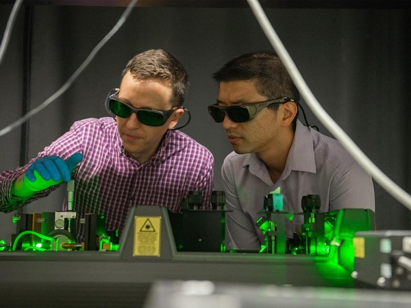 Alexander Castonguay (left), graduate student in the laboratory of Assistant Professor Lauren Zarzar, and Assistant Professor Huanyu “Larry” Cheng used this laser set up for their multi-disciplinary collaboration