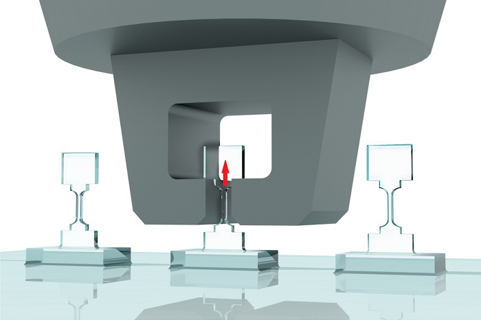 Illustration of tensile straining of microfabricated diamond bridge samples