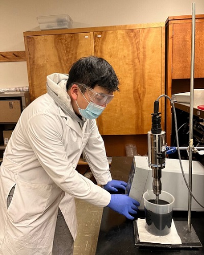 Graduate student Zhipeng Li prepares a nano-modified concrete sealer