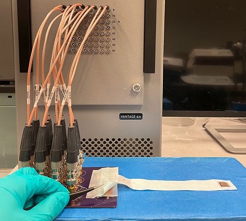 Ultrasound patch wired to its full experimental setup