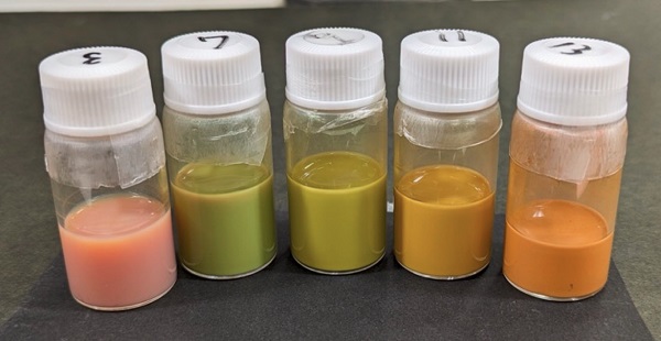 The nanospheres in a methanol suspension have different colors than when applied to a surface as a monolayer.