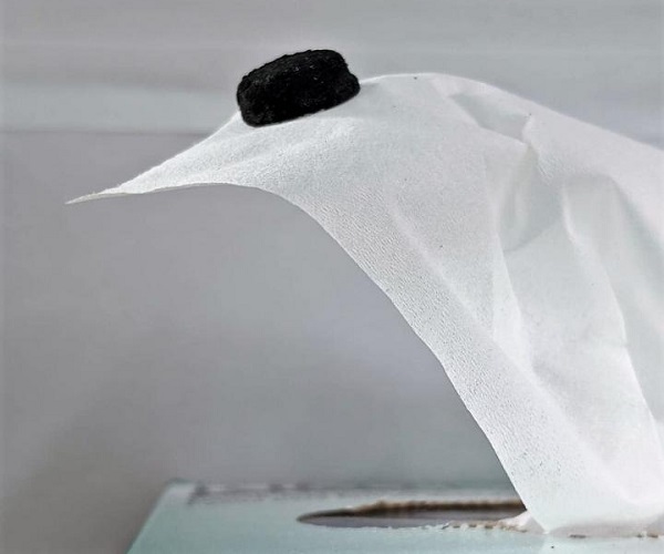 Graphene is incredibly light. This aerogel, used for filtering water, sits atop a single tissue. 
